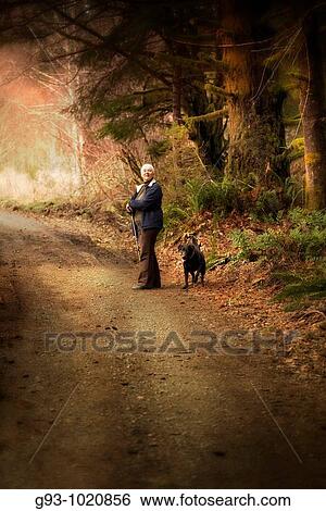 woman hiker on forest path with dog View Large Photo Image Stock Photograph - woman hiker on forest path with dog. Fotosearch