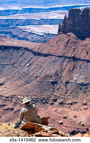 Woman Hiker Sitting on a Rock, Canyonlands National Park, Utah, USA View Large Photo Image Stock Image - Woman Hiker Sitting on a Rock, Canyonlands National Park, Utah, USA. Fotosearch