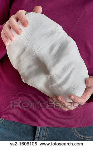 Woman holding a mask with a smiling face View Large Photo Image Stock Photography - Woman holding a mask with a smiling face. Fotosearch