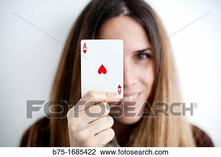 Stock Image - Woman holding ace. Fotosearch