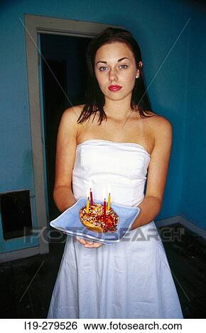 woman holding birthday donut View Large Photo Image Stock Photograph - woman holding birthday donut. Fotosearch