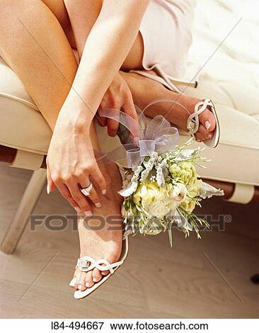 woman holding bouquet by feet View Large Photo Image Stock Photo - woman holding bouquet by feet. Fotosearch