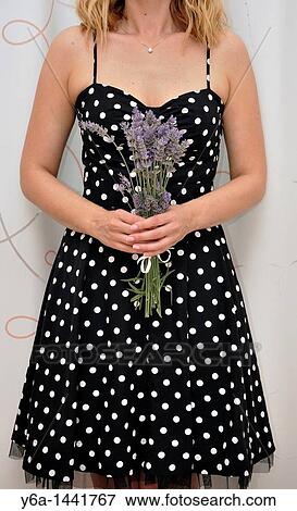 Stock Photo - Woman holding bunch of lavender. Fotosearch
