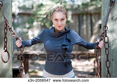Stock Photo - Woman holding chains.. Fotosearch