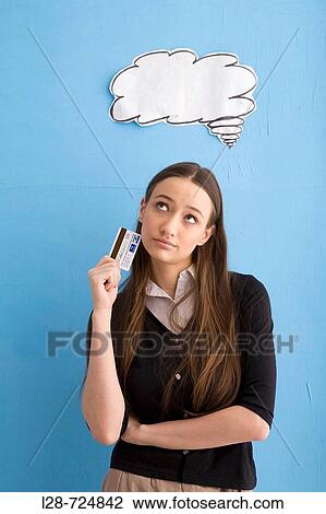 woman holding credit card with thought bubble View Large Photo Image Stock Image - woman holding credit card with thought bubble. Fotosearch