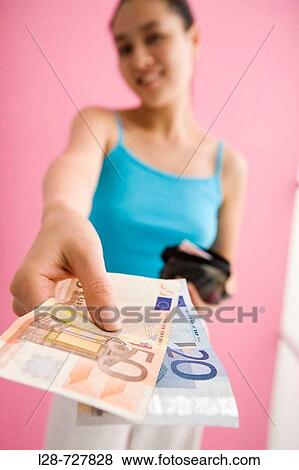 Stock Photo - Woman Holding European Banknote.. Fotosearch