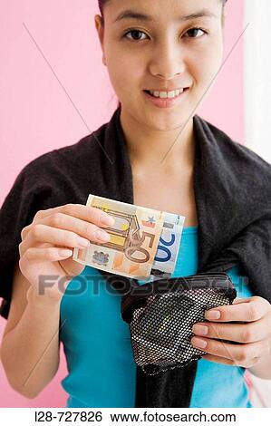 Stock Photograph - Woman Holding European Banknote.. Fotosearch