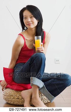 Woman holding glass orange juice View Large Photo Image Stock Image - Woman holding glass orange juice. Fotosearch
