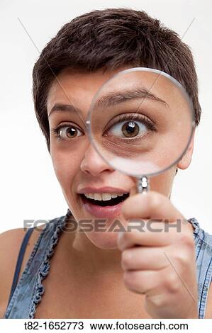 Woman holding magnifying glass View Large Photo Image Stock Image - Woman holding magnifying glass. Fotosearch