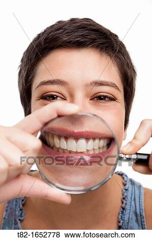 Woman holding magnifying glass View Large Photo Image Stock Photo - Woman holding magnifying glass. Fotosearch