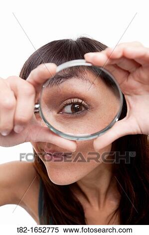 Woman holding magnifying glass View Large Photo Image Stock Photography - Woman holding magnifying glass. Fotosearch