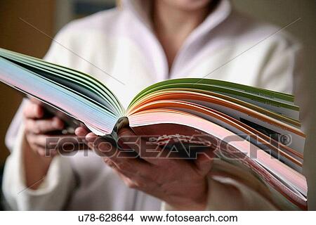 Woman holding text book View Large Photo Image Picture - Woman holding text book. Fotosearch