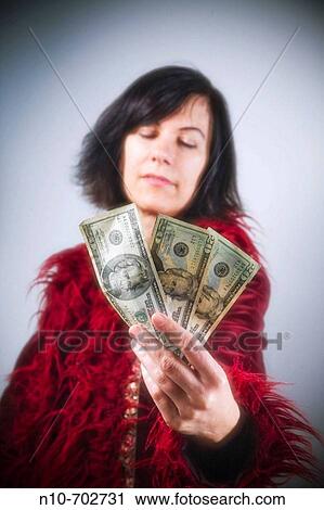 Woman holding three American twenty dollar bills. View Large Photo Image Stock Image - Woman holding three American twenty dollar bills.. Fotosearch
