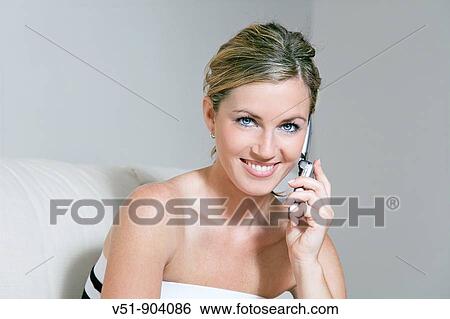 Woman, home, happy, calling, phoning, smiling, couch, sofa, time out View Large Photo Image Stock Photograph - Woman, home, happy, calling, phoning, smiling, couch, sofa, time out. Fotosearch