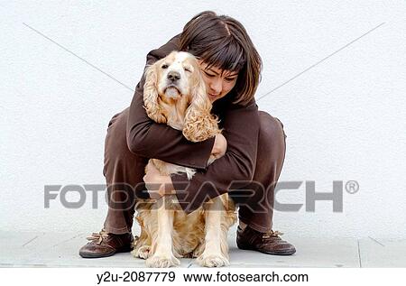 Woman hugging her dog. View Large Photo Image Stock Photo - Woman hugging her dog.. Fotosearch