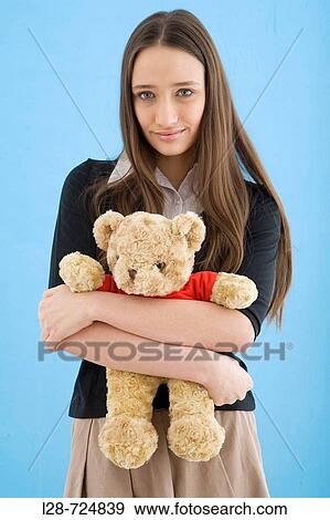 Woman hugging teddy bear View Large Photo Image Stock Photo - Woman hugging teddy bear. Fotosearch