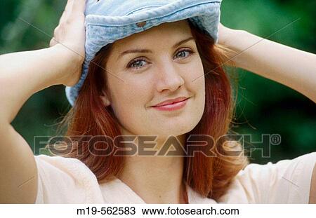 Stock Image - woman in a blue hat. Fotosearch