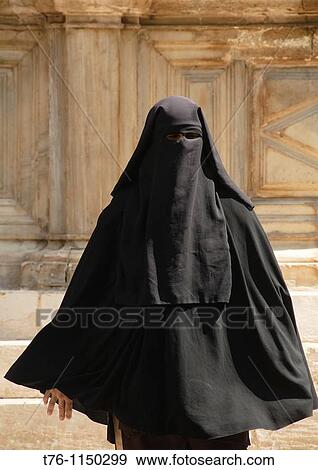 Stock Photo - woman in a burkha in Cairo Egypt. Fotosearch