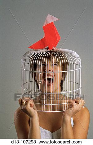 Stock Photo - Woman in a cage. Fotosearch