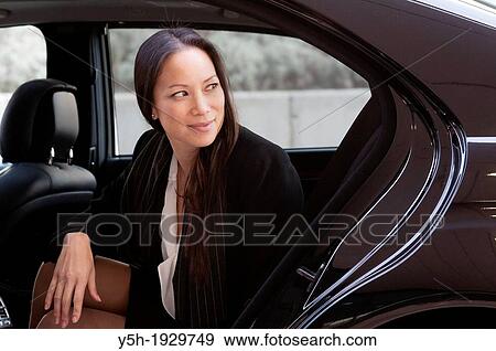 Woman in a car View Large Photo Image Stock Photo - Woman in a car. Fotosearch