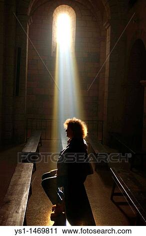 Woman in a Church with a Ray of Light View Large Photo Image Stock Image - Woman in a Church with a Ray of Light. Fotosearch