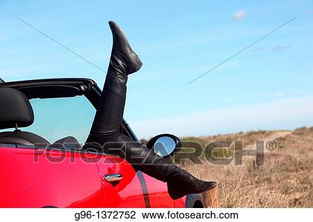 woman in a convertible relaxing at the beach View Large Photo Image Stock Image - woman in a convertible relaxing at the beach. Fotosearch