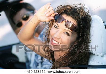 woman in a covertible View Large Photo Image Stock Image - woman in a covertible. Fotosearch