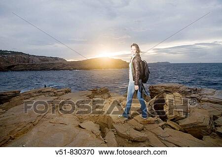 Stock Image - Woman in a excursion by the sea. Fotosearch