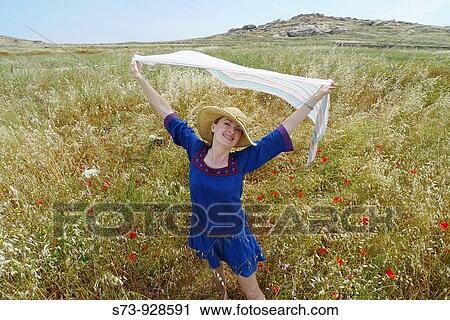 Woman in a field of Naxos, Cyclades Islands, Greece View Large Photo Image Stock Image - Woman in a field of Naxos, Cyclades Islands, Greece. Fotosearch