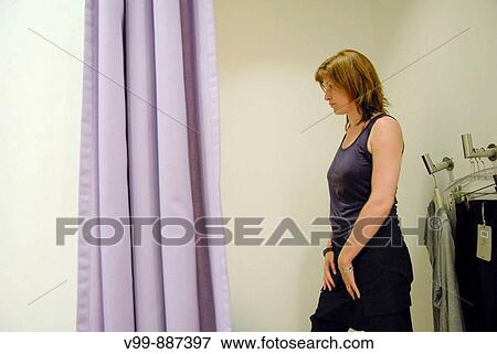 woman in a fitting room View Large Photo Image Stock Photo - woman in a fitting room. Fotosearch