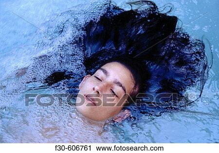Woman in a hot tub View Large Photo Image Stock Image - Woman in a hot tub. Fotosearch