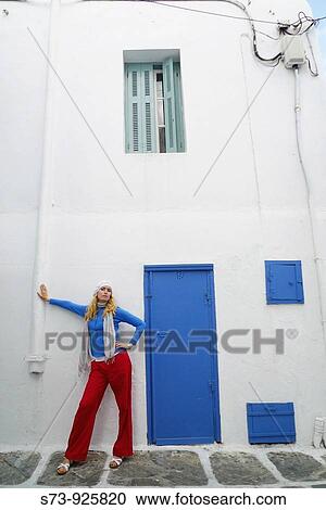 Woman in a Mykonos street, Cyclades Islands, Greece, Europe View Large Photo Image Stock Image - Woman in a Mykonos street, Cyclades Islands, Greece, Europe. Fotosearch