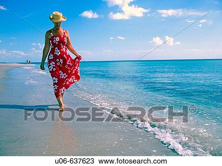 Woman in a nice dress walking, Casperson beach at Venice, Florida (USA) View Large Photo Image Stock Image - Woman in a nice dress walking, Casperson beach at Venice, Florida (USA). Fotosearch