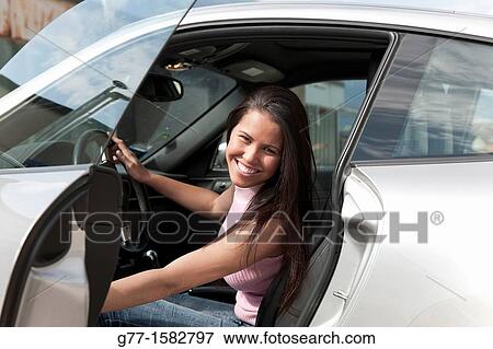 Stock Photo - Woman in a sport car.. Fotosearch