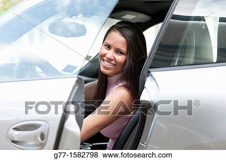 Woman in a sport car. View Large Photo Image Stock Photo - Woman in a sport car.. Fotosearch