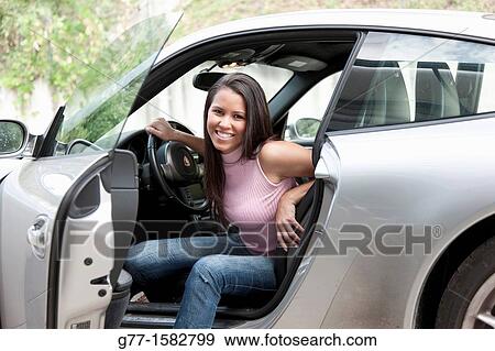 Woman in a sport car. View Large Photo Image Stock Photo - Woman in a sport car.. Fotosearch