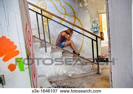 Woman in an abandoned factory View Large Photo Image Stock Photo - Woman in an abandoned factory. Fotosearch