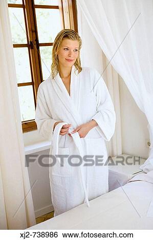 Woman in bathrobe at home View Large Photo Image Stock Photograph - Woman in bathrobe at home. Fotosearch