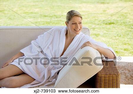 Woman in bathrobe relaxing at home View Large Photo Image Stock Image - Woman in bathrobe relaxing at home. Fotosearch