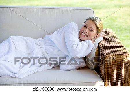 Woman in bathrobe relaxing outdoors View Large Photo Image Stock Photograph - Woman in bathrobe relaxing outdoors. Fotosearch