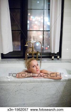 Woman in bathtub, Bowery Hotel, New York City USA View Large Photo Image Stock Photo - Woman in bathtub, Bowery Hotel, New York City USA. Fotosearch