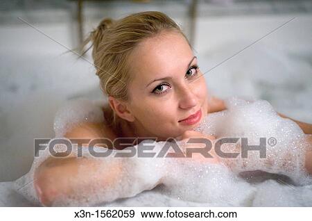 Woman in bathtub, Bowery Hotel, New York City USA View Large Photo Image Stock Photo - Woman in bathtub, Bowery Hotel, New York City USA. Fotosearch