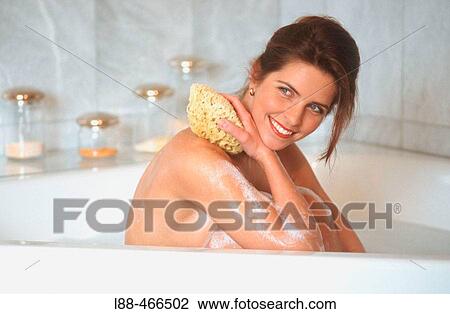 Stock Image - Woman in bathtub. Fotosearch