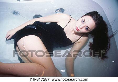 Woman in bathtub View Large Photo Image Stock Photo - Woman in bathtub. Fotosearch