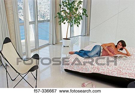 Woman in bedroom View Large Photo Image Stock Photo - Woman in bedroom. Fotosearch