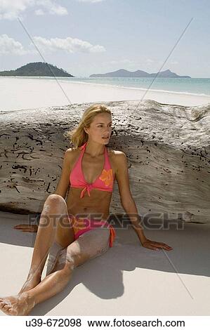 Woman in bikini sitting on Whitehaven Beach, Australia. View Large Photo Image Stock Photo - Woman in bikini sitting on Whitehaven Beach, Australia.. Fotosearch