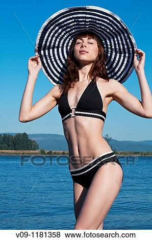 Woman in bikini with a hat, Columbia River, USA View Large Photo Image Stock Photo - Woman in bikini with a hat, Columbia River, USA. Fotosearch