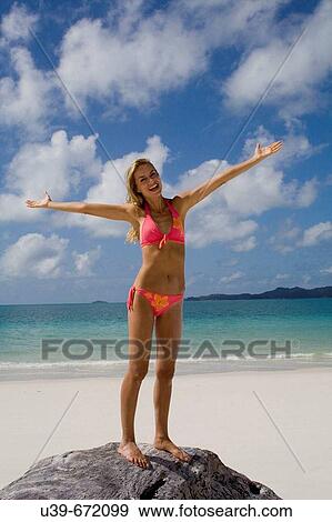 Woman in bikini with arms outsrtetched. Whitehaven Beach, Australia. View Large Photo Image Stock Photo - Woman in bikini with arms outsrtetched. Whitehaven Beach, Australia.. Fotosearch