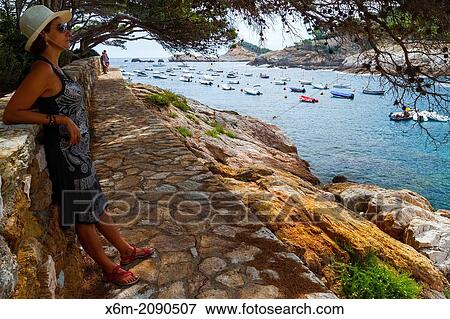 Stock Photo - Woman in Cala Aiguafreda. Begur. Costa Brava, Gerona. Catalonia, Spain, Europe.. Fotosearch