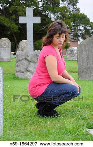 Stock Photo - Woman in cemetery. Fotosearch